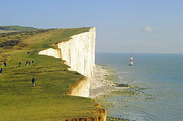 Walkers on cliff top, Beachy Head, Sussex, England, UK 