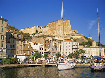 Yacht moored in harbour, with the citadel behind, Bonifacio, Corsica, France, Mediterranean, Europe