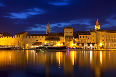 View of city across river, lit up at dusk, Trogir, UNESCO World Heritage Site, Dalmatian Coast, Croatia, Europe 