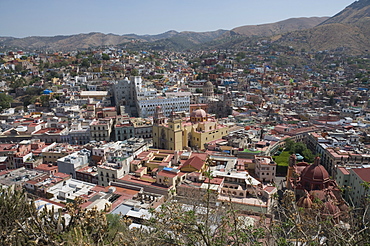 The Basilica de Nuestra Senora de Guanajuato, the yellow building in centre, with the blue grey building of the University of Guanajuato behind, in Guanajuato, a UNESCO World Heritage Site, Guanajuato State, Mexico, North America