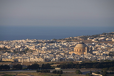 The dome of Mosta in distance viewed from Mdina the fortress city, Malta, Europe