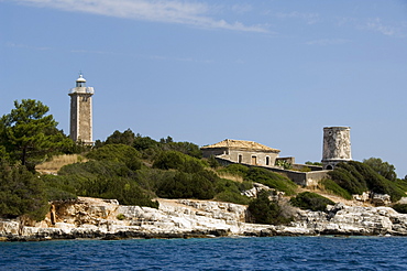 Lighthouse and old ruined lighthouse, Fiskardo, Kefalonia (Cephalonia), Ionian Islands, Greek Islands, Greece, Europe