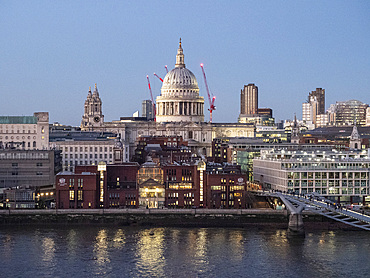 Skyline view at twilight of St. Paul's Cathedral and Millennium Bridge from Tate Modern, London, England, United Kingdom, Europe