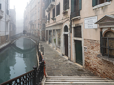 A misty winter morning by the canal, Fondamenta Tetta, Castello, Venice, Italy