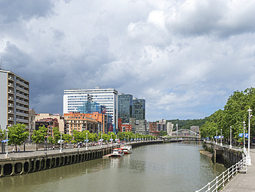 View towards the Calatrava (Zubizuri) Bridge, River Nervion, Bilbao, Basque Country, Spain, Europe