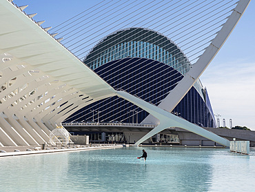 Man cleaning the pool outside the Science Museum and Agora, City of Arts and Sciences, Valencia, Spain, Europe
