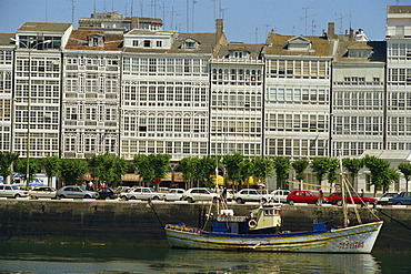 A fishing boat in the harbour of the town of La Coruna in Galicia, Spain, Europe