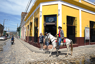 Horseman in the back streets, Trinidad, Sancti Spiritus Province, Cuba, West Indies, Caribbean, Central America