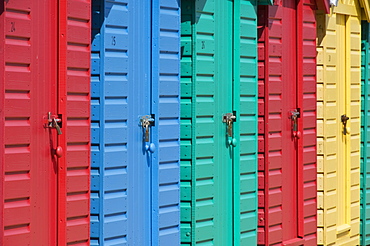 Close-up of multicoloured beach huts on the long sweeping beach of Llanbedrog, Llyn Peninsula, Gwynedd, North Wales, Wales, United Kingdom, Europe