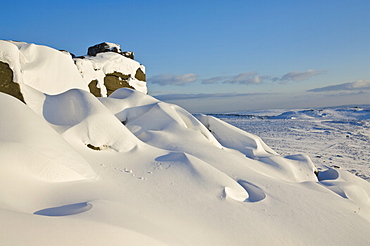 Snow drifts and snow covered moorland at Stanage Edge, Peak District National Park, Derbyshire, England, United Kingdom, Europe