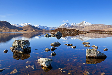 Snow covered mountains left to right are Stob a'choire Odhair, Aonach Mor, Beinn Mhic Chasgaig and Meall a'Bhuirudh, around Lochan na h-Achlaise, Lower Rannoch Moor, Argyll and Bute, Highlands, Scotland, United Kingdom, Europe