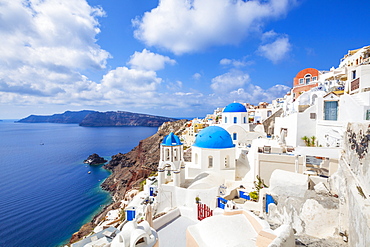 Greek church with three blue domes in the village of Oia, Santorini (Thira), Cyclades Islands, Greek Islands, Greece, Europe