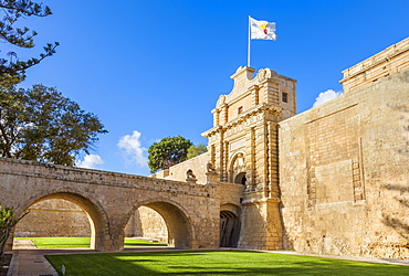 The Main gate with moat, garden and ramparts, Mdina, a Medieval walled city, Mdina, Malta, Europe