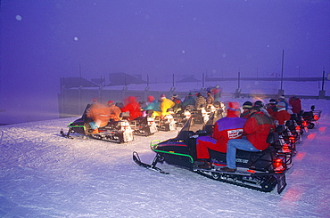 France, Alps, Savoie, Val Thorens In Winter, Snowmobiles Preparing To Leave For A Night Drive