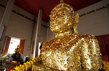 Thailand, Ayutthaya (Near Bangkok) Was The Siam Capital, Wat Yai Chai Mongkol Temple (Rebuilt In 1982), Close-Up On A Buddha Statue Gilted With Gold Leaves Offered By Believers