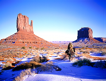 Usa, South West, Arizona & Utah, Monument Valley Navajo Reservation, Red Rocks Peaks (Mesas), Rider On A Horse In Winter