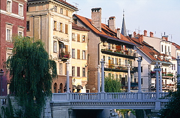 Slovenia, Ljubljana (Lubiana), Classic Housing Building Along The River Ljubljanica, Church At Back