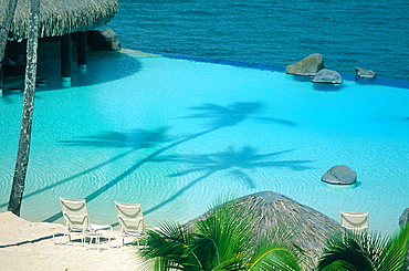 French Polynesia, Tahiti, Hotel Beachcomber Swimming Pool And Lagoon In Punaauia