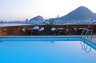 Brazil, Rio De Janeiro, Copacabana Beach, Swimming Pool On A Hotel Roof At Dusk