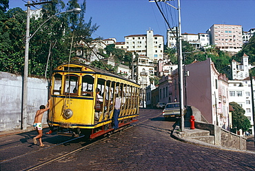 Brazil, Riodejaneiro, Child Trying To Catch The Tramway (Electrico)