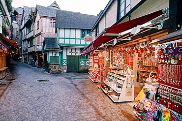 France, Normandy, Manche (50), Mont Saintmichel, The Shopkeepers Mainly Specialized In Selling Souvenirs Most Of Them Very Kitch, The Grand Rue At Dusk In Winter