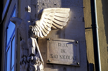 Portugal, Lisbon, Alfama Quarter, Road Sign And Carved Eagle At A Wall Corner