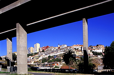 Portugal, Lisbon, Working Class Housing Sububs Seen Through Highway Bridge Piles