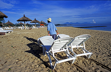 Indonesia, Bali Island, The Nusa Dua Beach, Removing Chairs At Dusk