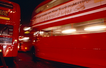 Double decker buses on Oxford Street at night, London, England, UK, Europe