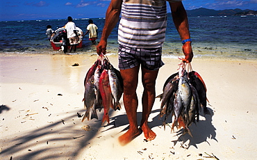 Seychelles, Praslin, Fisherman With Catch Of The Day