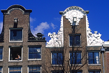 Netherlands, Amsterdam, Frontons Of Old Bricks Houses On A Canal