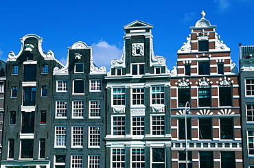 Netherlands, Amsterdam, Front Of Old Bricks Houses On A Canal