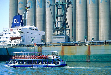 Spain, Catalonia, Barcelona, Tour Boat With Passengers Visiting The Harbour