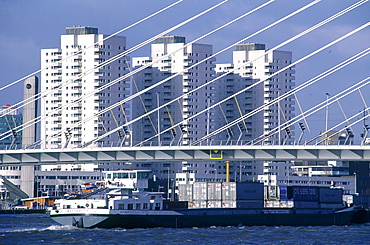 Netherlands, Rotterdam, Cargo Freighter Passing Under Erasmus Bridge