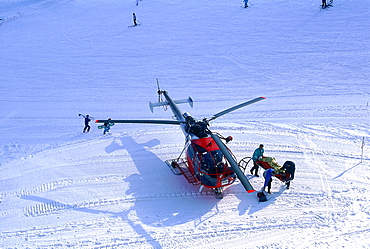 France, Alps In Winter, A Wounded Skier Being Evacuated By A Rescue Helicopter 