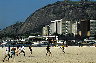 Brazil, Rio De Janeiro.Children Playing Football On The Beach