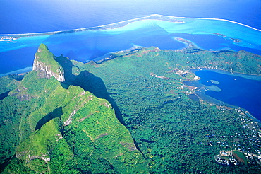 French Polynesia, The Leeward Islands (Iles Sous-Le-Vent), Bora-Bora Island, Aerial, Mount Otemanu To P, Vaitape Village On Right