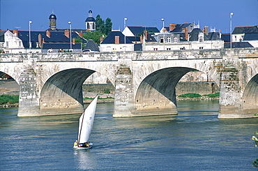 France, Val-De-Loire, Maine-Et-Loire, Saumur, Traditional Sailing Boat On River Loire, Saumur Stone Bridge At Back