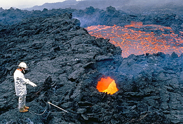 Vulcanologist at work, La Fournaise volcano, island of Reunion, Africa