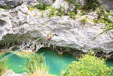 Man crossing the Verdon River on a rope, Provence-Alpes-Cote d'Azur, Provence, France, Europe