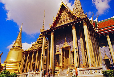 Phra Sri Ratana Golden Chedi and Phra Monhob buidling (the Royal Pantheon) and monks, Wat Phra Kaew, Grand Palace, Bangkok, Thailand