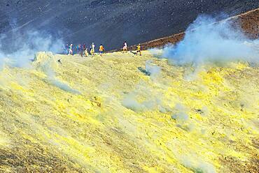 People walking on Gran Cratere rim, Vulcano Island, Aeolian Islands, UNESCO World Heritage Site, Sicily, Italy, Mediterranean, Europe