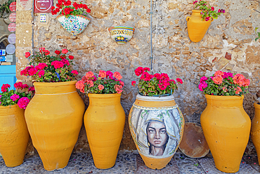 Traditional handmade glazed clay pots filled with flowers, Marzameni, Noto Valley, Sicily, Italy