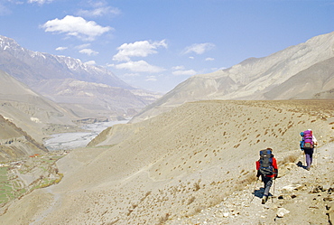 Two people trekking near KaGBeni, Southern Mustang, Nepal