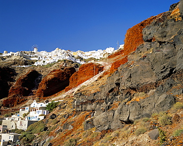 Volcanic rocks and Oia village, Oia, Santorini (Thira), Cyclades Islands, Greek Islands, Greece, Europe