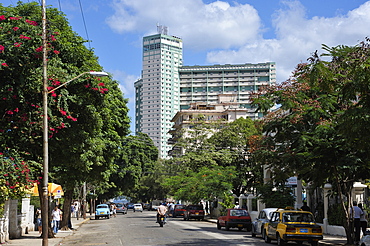 Calle 17 (17th Street) leading to the Focsa Building built in 1956, Vedado, Havana, Cuba, West Indies, Central America