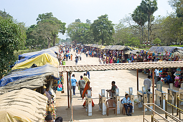 The bazaar in the street leading to the entrance gate to the grounds of the mid-13th century Sun Temple dedicated to the Hindu Sun God, Surya, Konarak, Puri District, Odisha, India, Asia