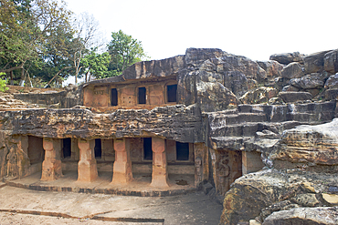 Monks' cells cut into the hillside rock among the Udayagiri and Khandagiri caves dating back to over 100 years BCE sculpted as religious retreats for Jain devotees, Bhubaneswar, Odisha, India, Asia