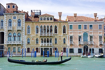 A gondola entering the Grand Canal seen from the Basilica of Santa Maria della Salute, Venice, UNESCO World Heritage Site, Veneto, Italy, Europe