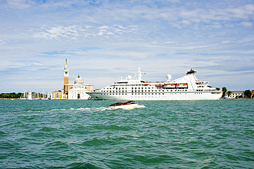 A cruise ship in the lagoon passing in front of San Marco Giardinetti seen from Punta della Dogana, Venice, UNESCO World Heritage Site, Veneto, Italy, Europe